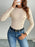 Perfee Decorative Button Round Neck Long Sleeve Bodysuit - Byyde