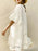 Eyelet Embroidered Tassel Tie Neck Dress - Byyde