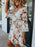 Floral V-Neck Three-Quarter Sleeve Mini Dress - Byyde