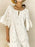 Eyelet Embroidered Tassel Tie Neck Dress - Byyde
